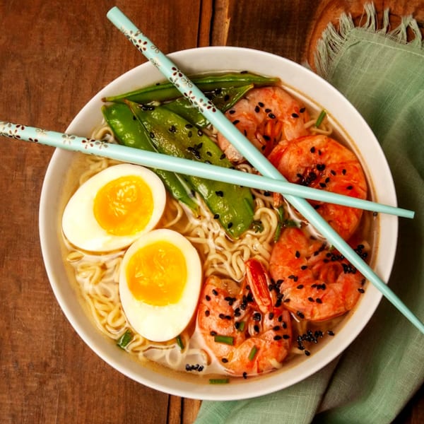 Ying Li Restaurant's shrimp ramen with soft-boiled eggs, snap peas, and black sesame seeds.